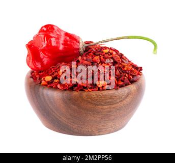 Fresh and dry ground red chili peppers isolated on white background. Capsicum baccatum or Bishop's crown pepper Stock Photo