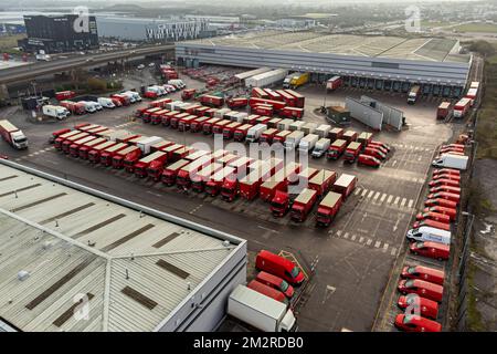 Royal Mail delivery vehicles and cages of mail at the Bristol Filton office. Picture date: Wednesday December 14, 2022. Stock Photo