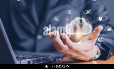 man use Laptop with cloud computing diagram show on hand. Cloud technology. Data storage. Networking and internet service concept. Stock Photo