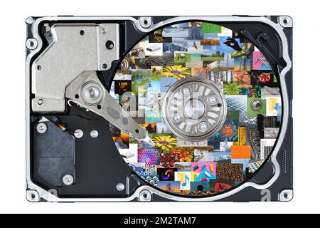 An open hard drive with a collage of photos on the surface of the drive. The concept of storing photos on electronic media. Stock Photo