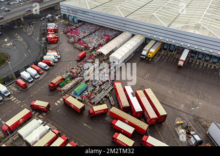 Royal Mail delivery vehicles and cages of mail at the Bristol Filton office. Picture date: Wednesday December 14, 2022. Stock Photo