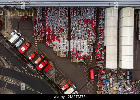 Royal Mail delivery vehicles and cages of mail at the Bristol Filton office. Picture date: Wednesday December 14, 2022. Stock Photo