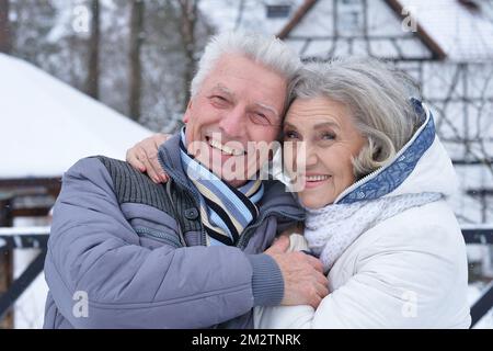 Nicel elderly couple rejoice together in winter Stock Photo