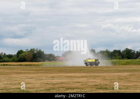 Hasselt. Limburg - Belgium 27-08-2022 Showing to the public of the technical capabilities of a fire truck on a grass runway. Outdoor public show of vi Stock Photo