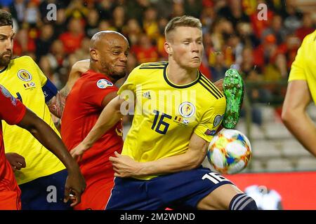 Belgium's Vincent Kompany and Scotland's Scott McTominay fight for the ball during a soccer game between Belgian national team the Red Devils and Scotland, Tuesday 11 June 2019 in Brussels, an UEFA Euro 2020 qualification game. BELGA PHOTO BRUNO FAHY Stock Photo