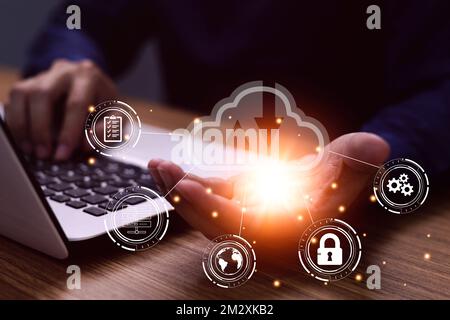 man use Laptop with cloud computing diagram show on hand. Cloud technology. Data storage. Networking and internet service concept Stock Photo