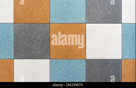 Multi-colored square ceramic tiles for the floor of the kitchen or bathroom. Stock Photo