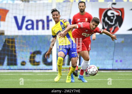 STVV's Hamza Masoudi and Standard's Gojko Cimirot fight for the ball during a soccer match between Sint-Truidense VV and Standard de Liege, Sunday 11 August 2019 in Sint-Truiden, on the third day of the 'Jupiler Pro League' Belgian soccer championship season 2019-2020. BELGA PHOTO JOHAN EYCKENS Stock Photo