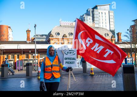 Slough, Berkshire, UK. 14th December, 2022. Rail staff from Slough Station were picketing outside Slough railway station today in the freezing cold on another day of sub zero temperatures in a dispute over pay and the planned closure of ticket offices. GWR trains and Elizabeth Line trains were running to and from London but the station was much quieter than normal as many people decided to work from home. Credit: Maureen McLean/Alamy Live News Stock Photo