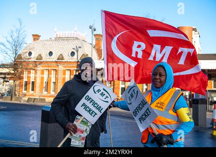 Slough, Berkshire, UK. 14th December, 2022. Rail staff from Slough Station were picketing outside Slough railway station today in the freezing cold on another day of sub zero temperatures in a dispute over pay and the planned closure of ticket offices. GWR trains and Elizabeth Line trains were running to and from London but the station was much quieter than normal as many people decided to work from home. Credit: Maureen McLean/Alamy Live News Stock Photo