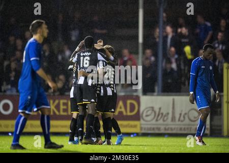 Charleroi's players celebrate after scoring during a soccer match ...