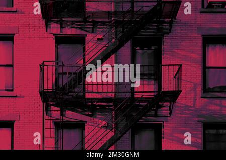 Close up New York City apartment building with brick exterior, windows, and diagonal fire escape stairs color graded in viva magenta Stock Photo