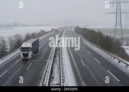 Coburg, Germany. 14 December 2022. Snow falling on the A73 near Coburg this afternoon. Bad weather with snow and ice has made travelling more difficult today throughout Bavaria. The German weather service has issued a warning of dangerous conditions on the road and possible disruptions to rail travel. Stock Photo