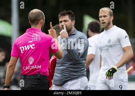 Racing's goalkeeper Jeremy Gucassoff talks to a referee during a hockey game between Waterloo Ducks and Royal Racing de Bruxelles, on the third day of the Belgian first division hockey championship, Sunday 22 September 2019 in Leuven. BELGA PHOTO KRISTOF VAN ACCOM Stock Photo