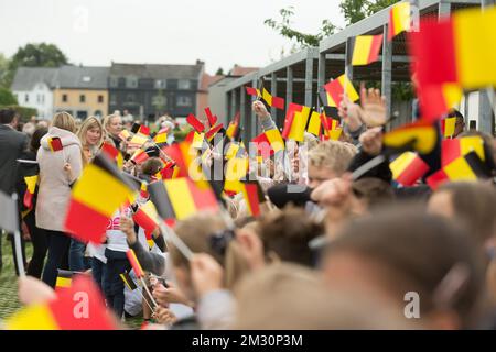 Children wave small Belgian flags during a visit of the King to VillaVip, a housing project for adults with disabilities, Thursday 03 October 2019, in Herzele. BELGA PHOTO JAMES ARTHUR GEKIERE Stock Photo