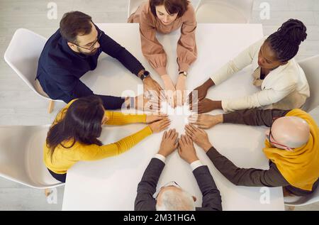 People sitting around table during business meeting Stock Photo - Alamy