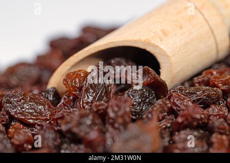 Raisins on a spice scoop in a close-up Stock Photo