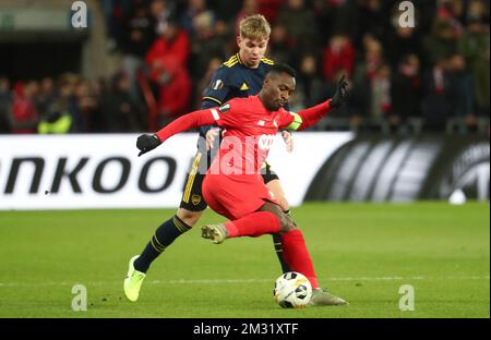 Arsenal's Emile Smith Rowe and Standard's Paul-Jose Mpoku Ebunge fight for the ball during a soccer match of Belgian team Standard de Liege against English club Arsenal F.C., Thursday 12 December 2019 in Liege, on the sixth and last day of the group stage of the UEFA Europa League, in group F. BELGA PHOTO VIRGINIE LEFOUR Stock Photo
