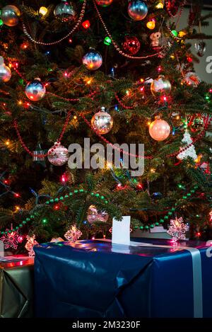 Festive Moments - Wrapped Christmas presents under the tree Stock Photo