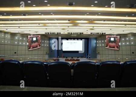 Huge and luxurious University auditorium chairs with presentation big screen. Blue theatre chairs. Stock Photo