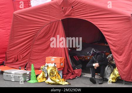 Illustration shows a man injured sitting in the emergency tent near the site of an accident with buses that occured inside the Beverentunnel, in the direction of The Netherlands, Tuesday 04 February 2020.Reports state that two buses, one truck and one car are involved in the accident. One person died in the accident, five are seriously injured and 44 lightly injured. BELGA PHOTO DIRK WAEM  Stock Photo