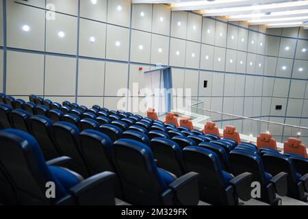 Huge and luxurious University auditorium chairs. Blue theatre chairs. Stock Photo