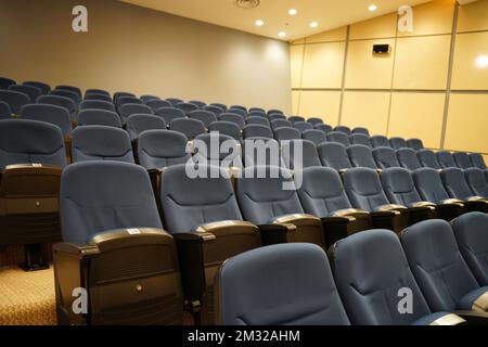 Huge and luxurious University auditorium chairs. Blue theatre chairs. Stock Photo