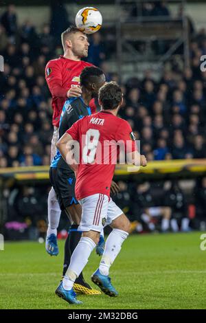 Manchester United's Luke Shaw and Club's Clinton Mata fight for the ball during a game of the 1/16 finals of the UEFA Europa League between Belgian soccer club Club Brugge and English club Manchetser United, in Brugge, Thursday 20 February 2020. BELGA PHOTO KURT DESPLENTER Stock Photo