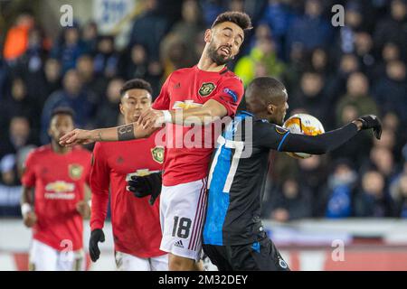 Manchester United's Bruno Fernandes and Club's Clinton Mata fight for the ball during a game of the 1/16 finals of the UEFA Europa League between Belgian soccer club Club Brugge and English club Manchetser United, in Brugge, Thursday 20 February 2020. BELGA PHOTO KURT DESPLENTER Stock Photo