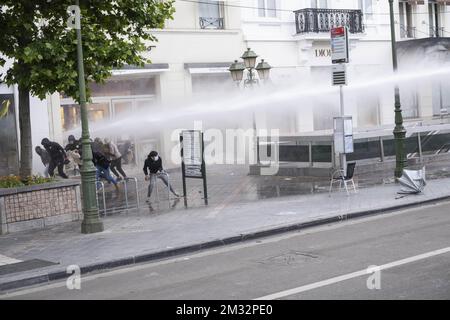 Illustration shows police using water pomp truck at the Boulevard de Waterloo as there are some troubles after the anti-racism protest, part of the Black Lives Matter protests, in Brussels, Sunday 07 June 2020. Accross Belgium, several BLM - protests are organised, in support of the protests and anti-racism movement in the USA, following the death of George Floyd, an innocent black man killed by a white police officer. BELGA PHOTO ANTONY GEVAERT  Stock Photo