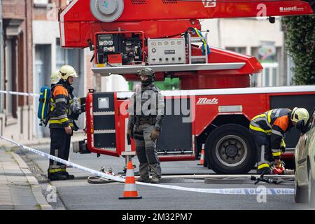 Illustration picture shows firefighters at the scene in the Rue de la Station street in Mouscron, where a woman locked herself into her house, Thursday 11 June 2020. BELGA PHOTO KURT DESPLENTER Stock Photo