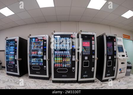 Savigliano, Italy - december 07, 2022:  group of vending machines for coffee, drinks and snacks in the refreshment area in an Italian hospital, fish e Stock Photo