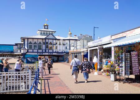 Eastbourne East Sussex People on Eastbourne Promenade going to Eastbourne Pier on Eastbourne seafront Eastbourne East Sussex England UK GB Europe Stock Photo