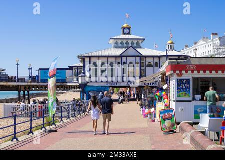 Eastbourne East Sussex People on Eastbourne Promenade going to Eastbourne Pier on Eastbourne seafront Eastbourne East Sussex England UK GB Europe Stock Photo