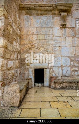 Door of Humility, main entrance into the Church of the Nativity in Bethlehem, Palestine, Israel, UNESCO World heritage Site as the birthplace of Jesus. Stock Photo