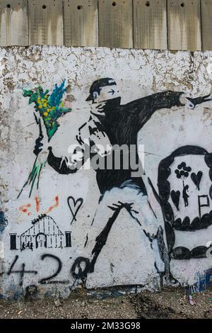 A banksy graffiti on the separation wall, Palestine Stock