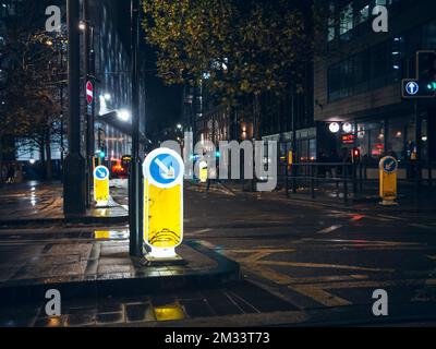 Illuminated traffic signals in England. Stock Photo