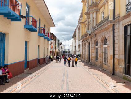 An antique colonial street in Candelaria neighborhood at bogota colombia historic downton in sunny day. Stock Photo