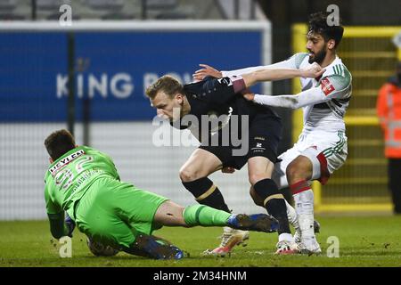 Antwerp's goalkeeper Ortwin De Wolf, Antwerp's Ritchie De Laet and OHL's Mousa Tamari fight for the ball during a soccer match between OH Leuven and Royal Antwerp FC, Monday 01 March 2021 in Oud-Heverlee, on day 28 of the 'Jupiler Pro League' first division of the Belgian championship. BELGA PHOTO LAURIE DIEFFEMBACQ Stock Photo