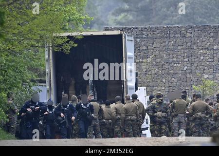 Illustration picture shows heavily armed police and soldiers preparing themselves at the entrance to Nationaal Park Hoge Kempen in Maasmechelen, Thursday 20 May 2021. Police continues to look for a heavily armed professional soldier, Jurgen Conings, in the province of Limburg. The 46-year old man made threats against virologist Van Ranst who is brought to safety. BELGA PHOTO DIRK WAEM  Stock Photo
