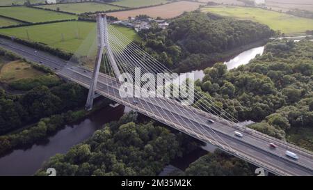 Mary McAleese Boyne Valley Bridge Cable-stayed in the Republic of Ireland over green fields Stock Photo