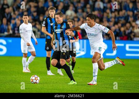 Club's Hans Vanaken and Manchester City's Rodri fight for the ball during a game between Belgian soccer team Club Brugge and English club Manchester City, Tuesday 19 October 2021, in Brugge, Belgium, the third (out of six) in the Group A of the UEFA Champions League group stage. BELGA PHOTO KURT DESPLENTER Stock Photo