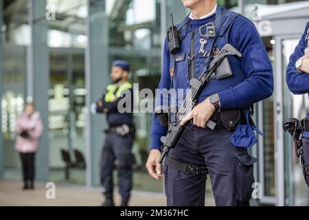Illustration picture shows heavily armed police outside the Justice Palace during the composition of the jury for the trial of Hicham Chaib, before the Antwerp Assises Court, in Antwerp, Thursday 21 October 2021. Chaib is the former assistant of Sharia4Belgium leader Fouad Belkacem, who is accused of terrorist murder in Syria. A few days after the March 22, 2016 attacks in Brussels and Zaventem, a video from Islamic State surfaced in which Chaib glorifies the attacks. At the end of the video, he shoots a prisoner in an orange suit twice in the head. The execution footage was deemed authentic b Stock Photo
