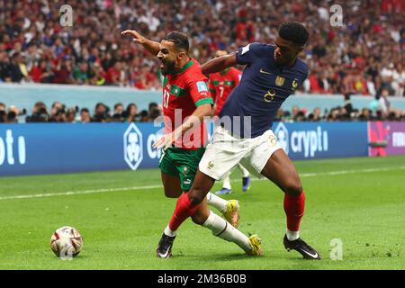 Al Khor, Qatar. 14th Dec, 2022. Aurelien Tchouameni (R) of France in action with Sofiane Boufal of Morocco during the 2022 FIFA World Cup Semi-Final match at Al Bayt Stadium in Al Khor, Qatar on December 14, 2022. Photo by Chris Brunskill/UPI Credit: UPI/Alamy Live News Stock Photo