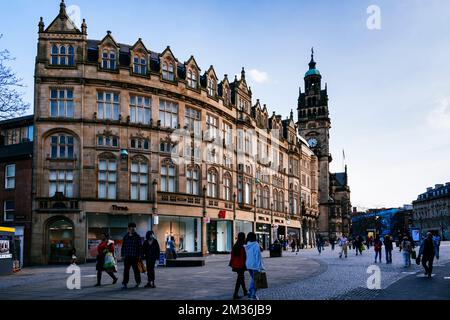 Carmel House, in the background the clock tower of Sheffield Town Hall. Fargate is a pedestrian precinct and shopping area in Sheffield, England. It r Stock Photo