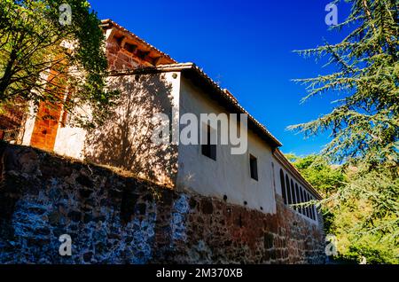 The San Millán Suso Monastery was founded by San Millán in the 6th century. The monastery consists of hermits' caves and a church. It forms part of th Stock Photo