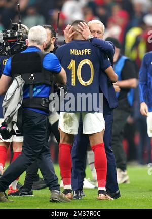 France manager Didier Deschamps (right) and Kylian Mbappe celebrate victory after the final whistle in the FIFA World Cup Semi-Final match at the Al Bayt Stadium in Al Khor, Qatar. Picture date: Wednesday December 14, 2022. Stock Photo
