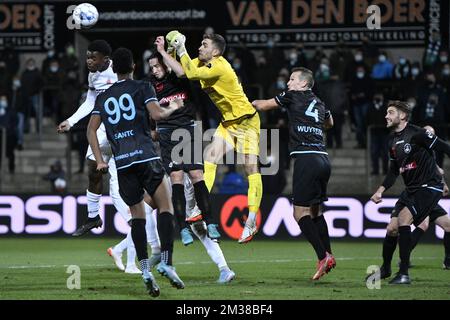 Virton's Maximilian Jansen, Lommel's Kevin Kis and Lommel's goalkeeper Jari De Busser fight for the ball during a soccer match between Lommel SK and Royal Excelsior Virton, Sunday 13 February 2022 in Lommel, on day 20 of the '1B Pro League' second division of the Belgian soccer championship. BELGA PHOTO JOHAN EYCKENS Stock Photo