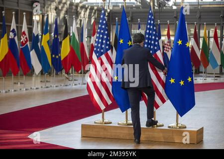 Illustration picture shows staff preparing a display with the European and US flags during a meeting of European council, in Brussels, Thursday 24 March 2022, at the European Union headquarters in Brussels. The European Council will discuss the Russian military aggression against Ukraine, security and defence, energy, economic issues, COVID-19 and external relations. BELGA PHOTO POOL NICOLAS MAETERLINCK  Stock Photo