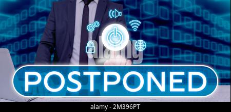 Hand writing sign Postponed, Concept meaning to place later in order of